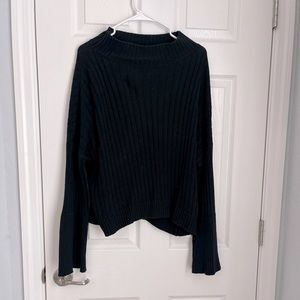 Lose fitted comfy sweater with bell sleeves and cowl neck